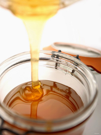 paul-blundell-organic-honey-running-into-a-honey-jar.jpg